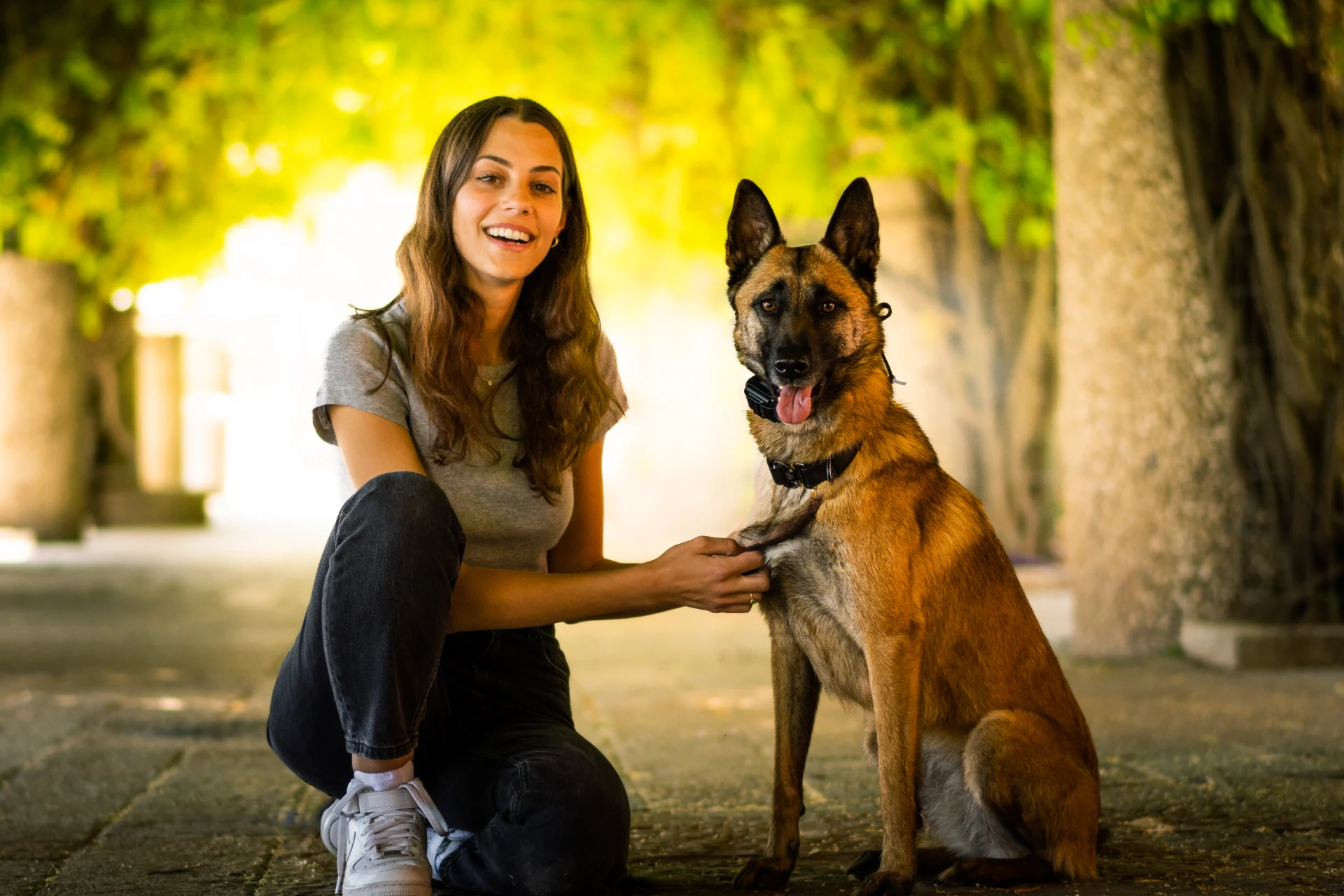 Woman and trained protection dog, illustrating family matching process.